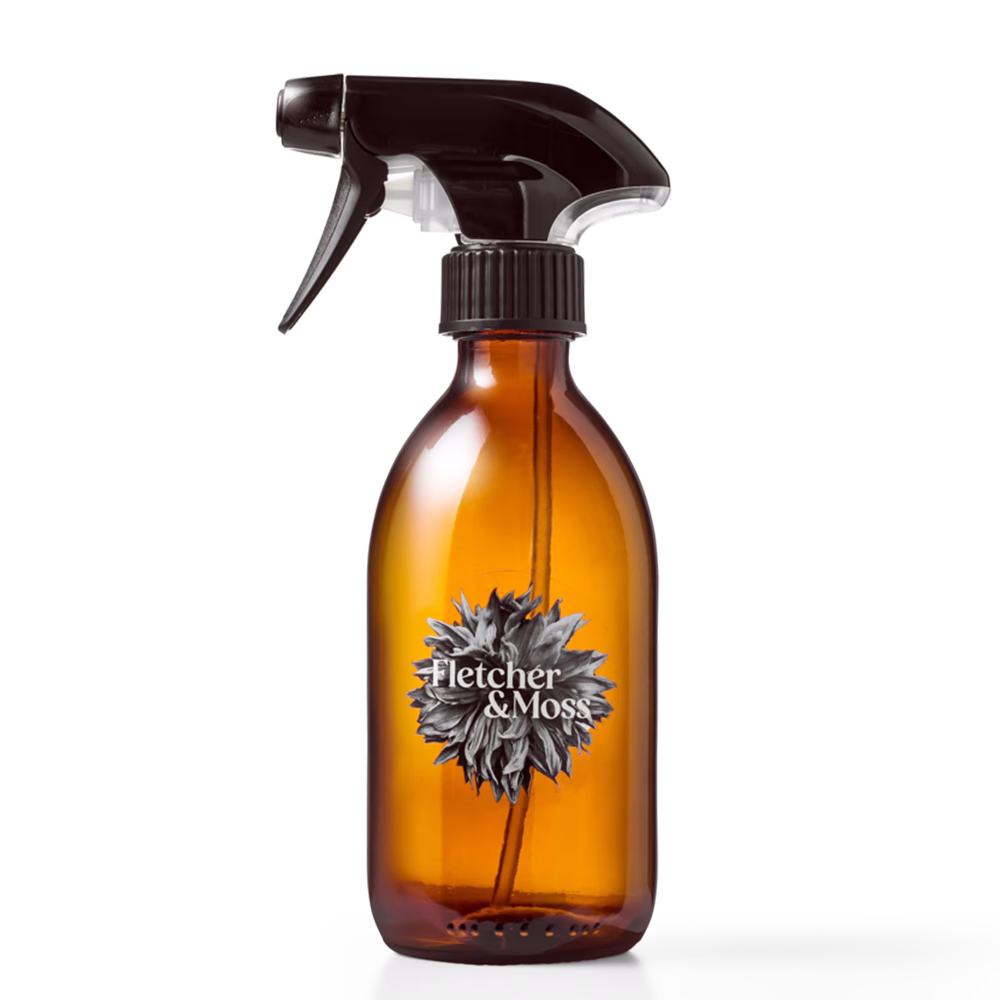 Amber spray bottle with black nozzle