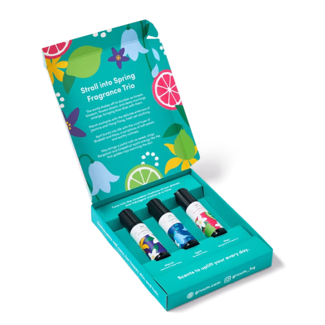 Colorful perfume box with three bottles.