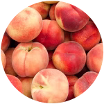 Piles of ripe peaches.