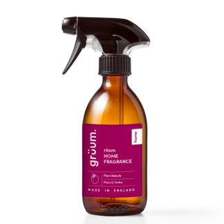 Amber spray bottle with fragrance label.