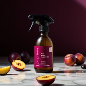 Room fragrance bottle with plums