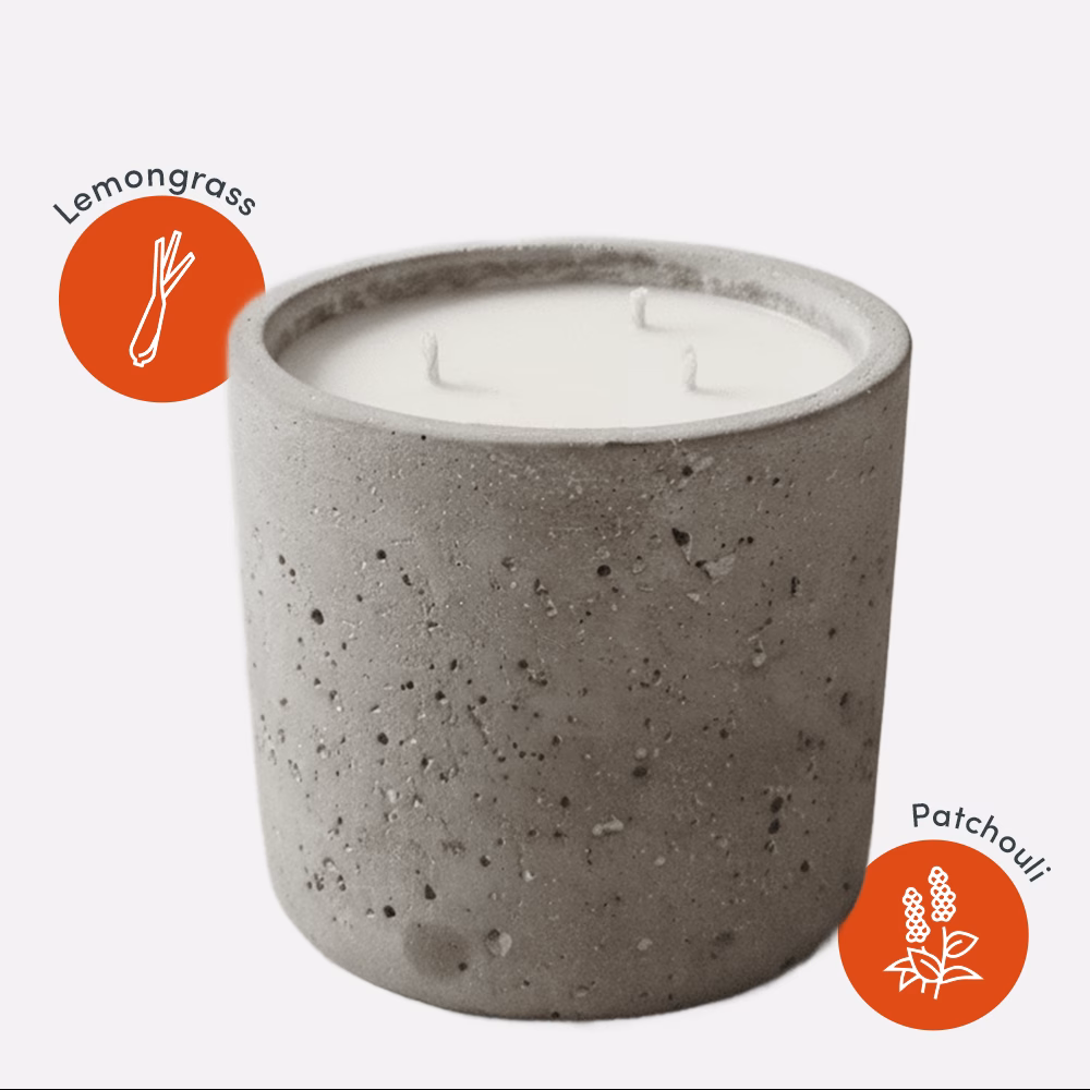 Concrete candle with lemongrass and patchouli icons.