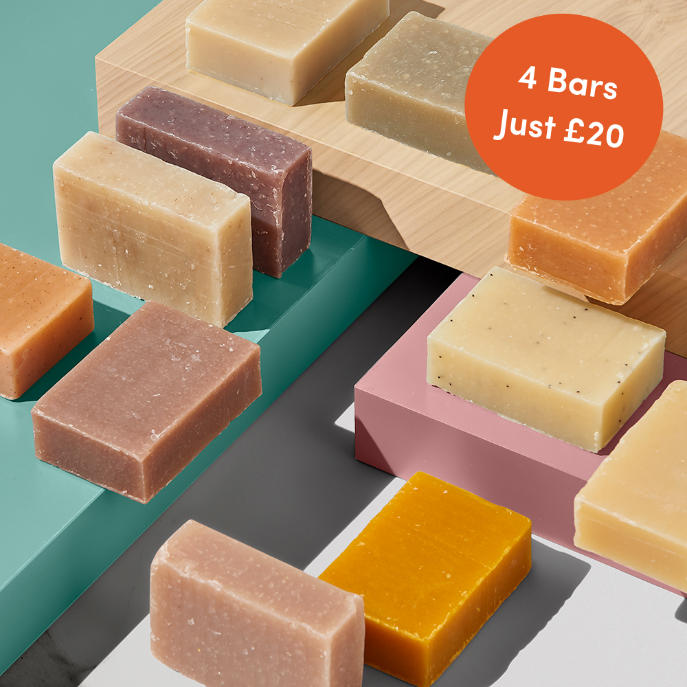 Assorted soap bars on colored blocks.