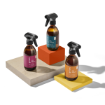 Three spray bottles on colored blocks
