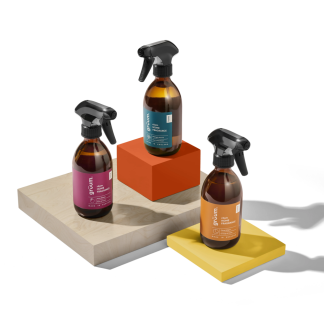 Three spray bottles on colored blocks