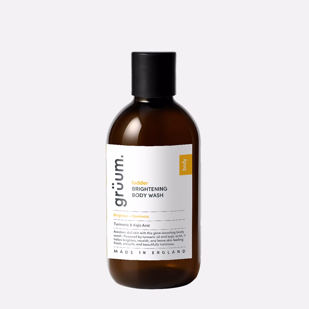 Brown bottle of brightening body wash.