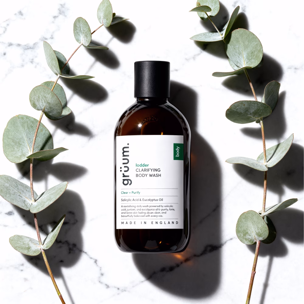 Body wash bottle with eucalyptus leaves.