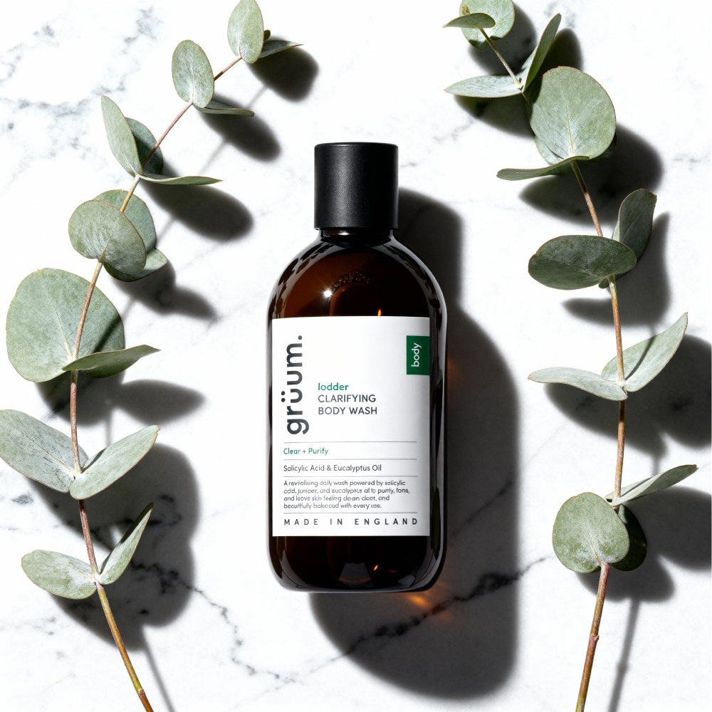 Body wash bottle with eucalyptus leaves.