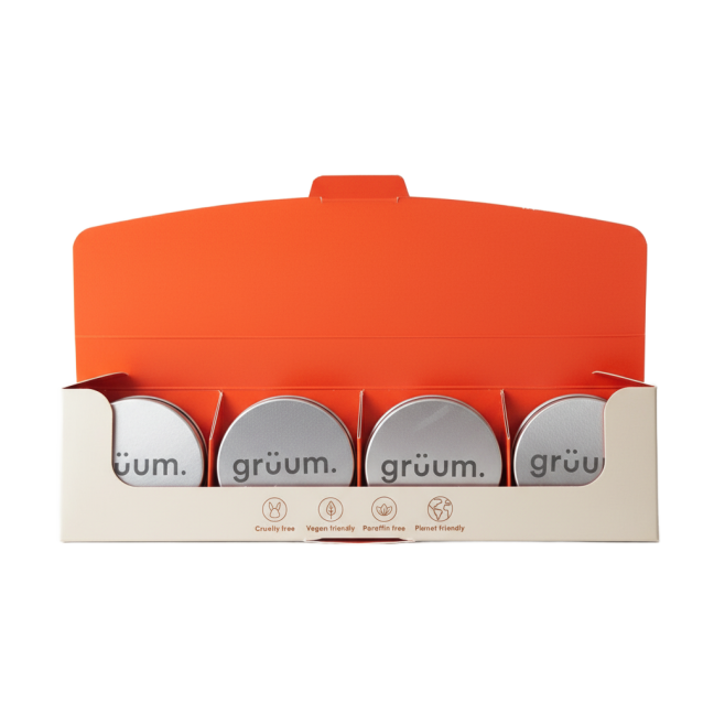 Open box with four tins inside.