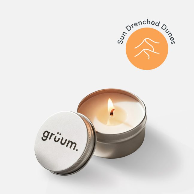Lit candle in a tin