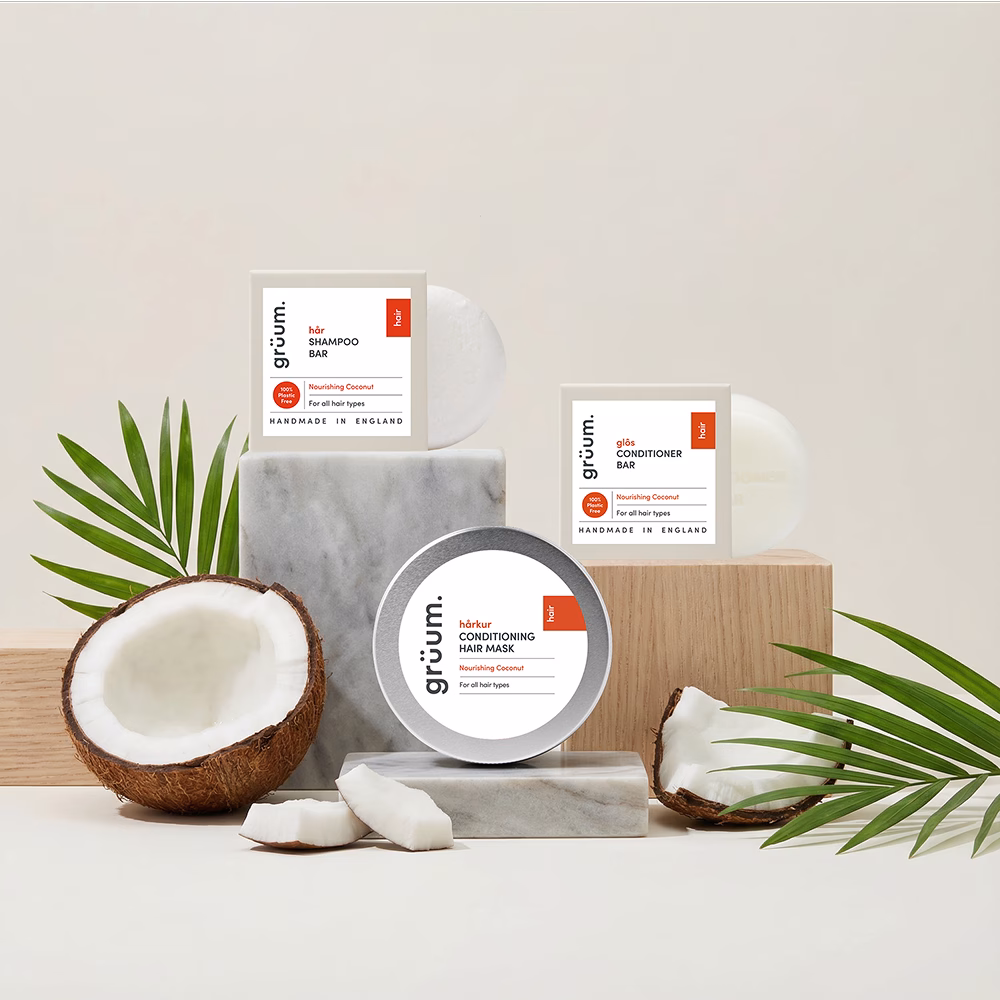 Coconut hair products and leaves display.