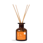 Brown reed diffuser bottle on black background.