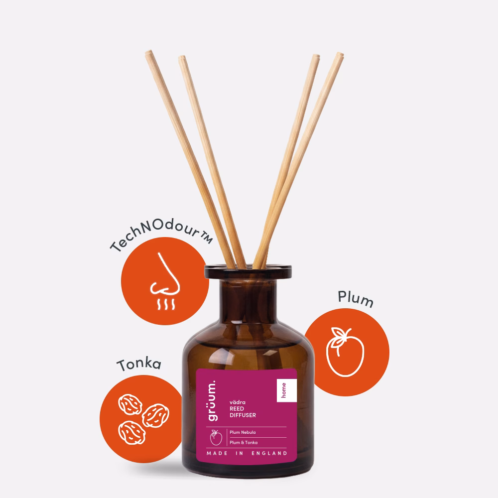 Brown reed diffuser with wooden sticks.