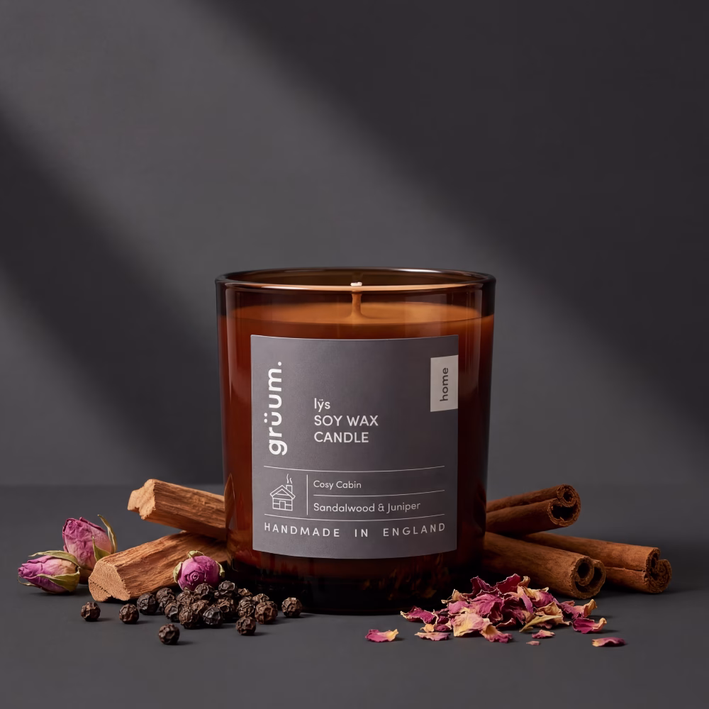 Brown candle with cinnamon and flowers