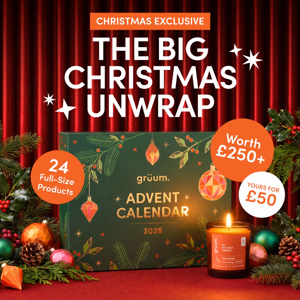Festive advent calendar and candle with holiday decorations