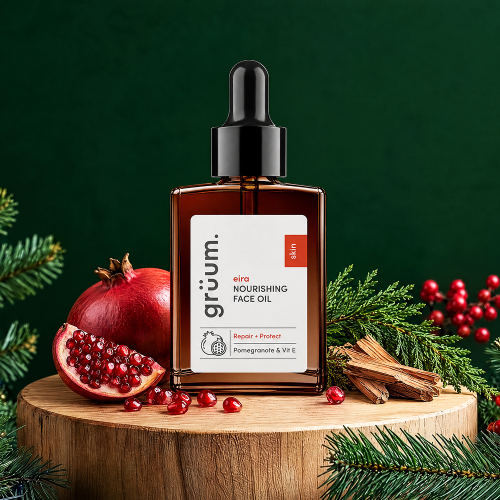 Nourishing face oil with pomegranate on a festive green background