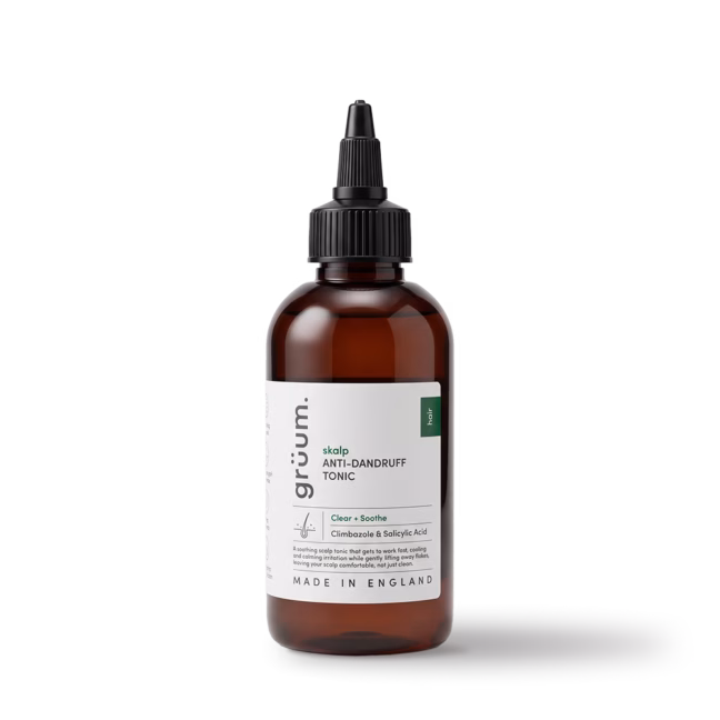 amber bottle of anti-dandruff scalp tonic