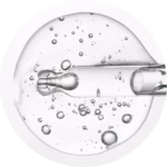 clear dropper releasing liquid with suspended bubbles